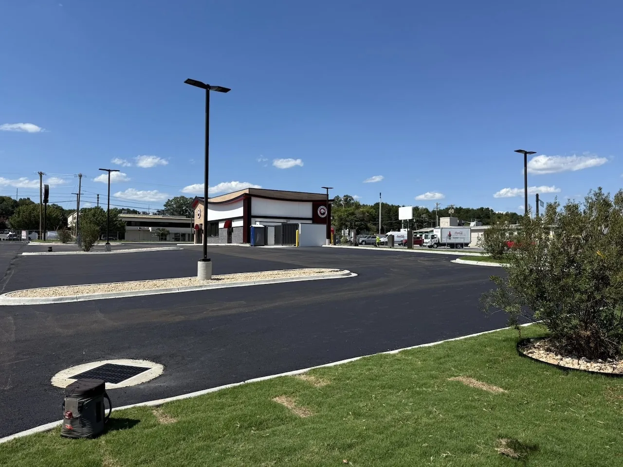 Benefits of Asphalt Sealcoating in Danville For Retail Pavement — E Wells Paving resource