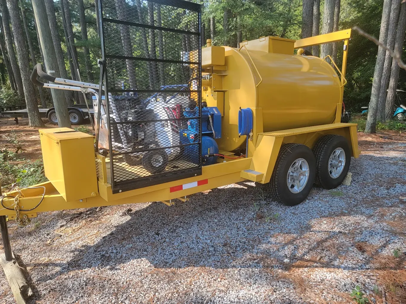 Yellow sealcoating tank and equipment trailer